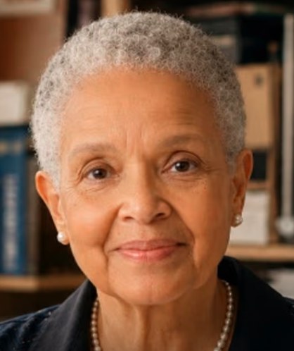 Sandra K. Lynch, visionary behind the 1 Million Sparks: Testimony Movement, seated in an ivory jacket.